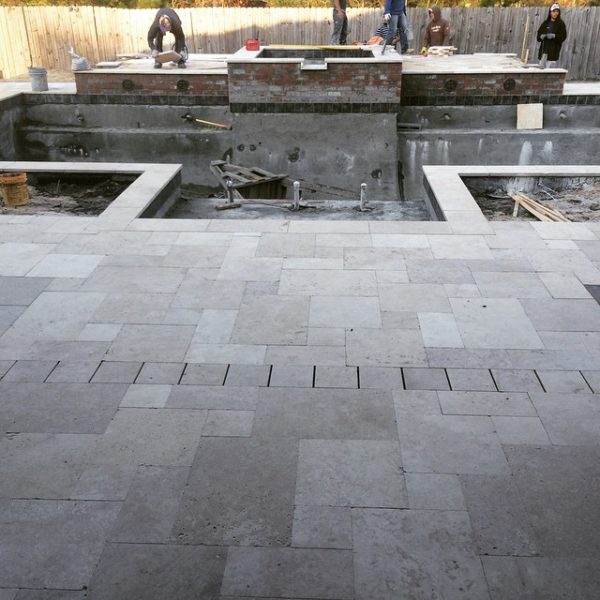 Custom travertine drain Crystal Pools and Spas