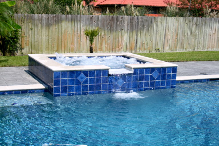 decorative tile pattern on a raised hot tub Crystal Pools and Spas